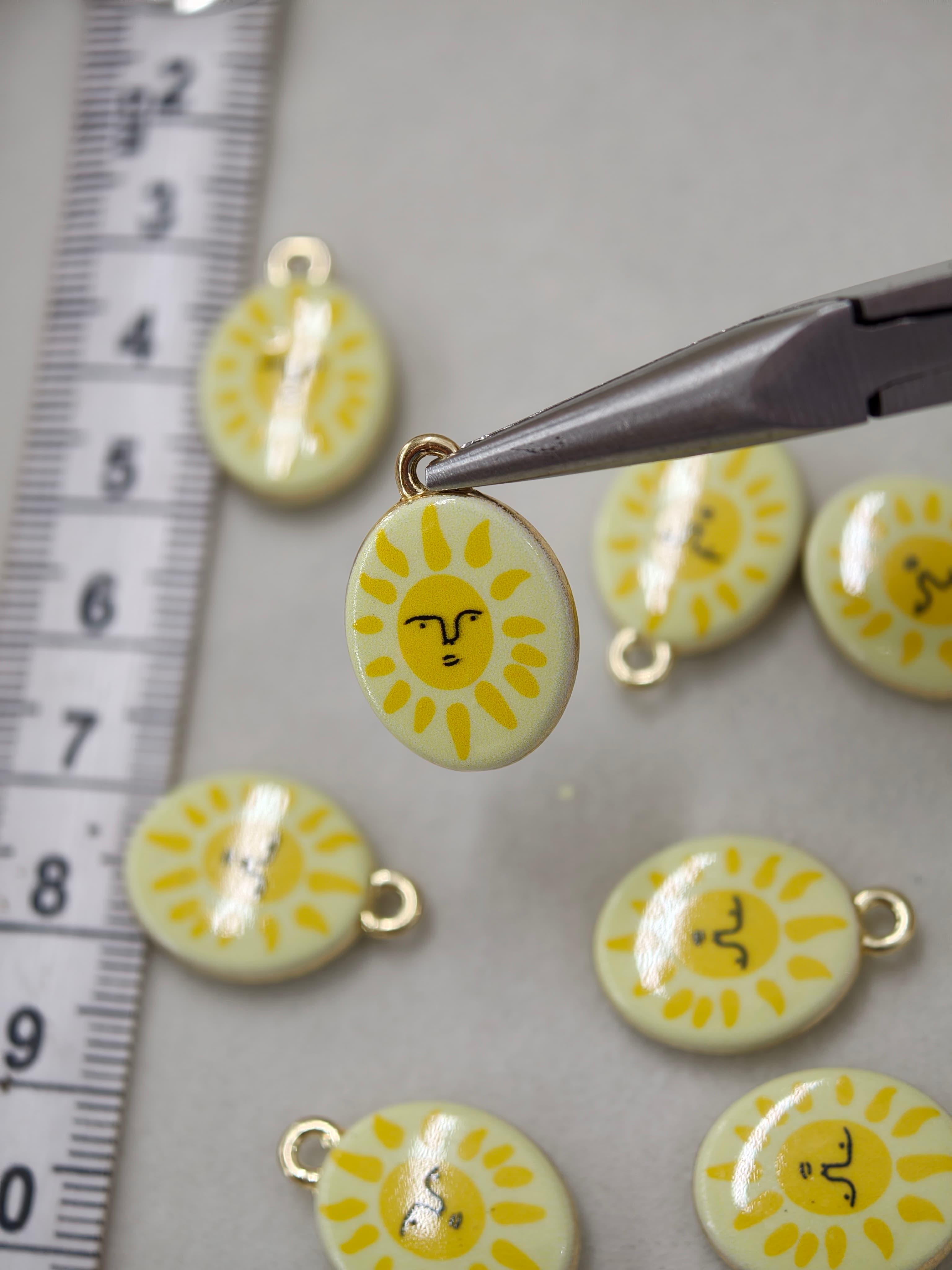Two sided enamel sun charm 